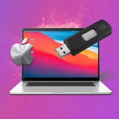 MacBook nie widzi pendrive. Metalowe logo Apple obok laptopa z podłączonym pendrivem, sugerujące problem z odczytem danych.